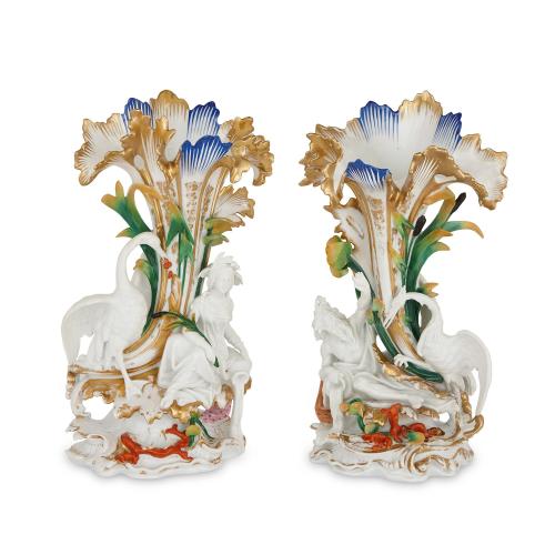 Pair of antique glazed biscuit porcelain figural vases