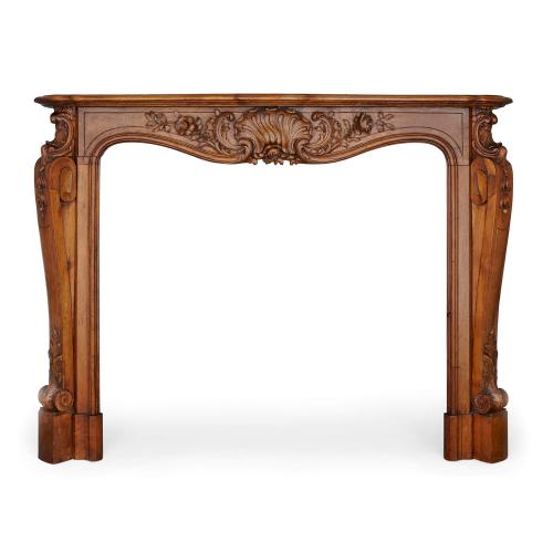 Antique French carved walnut fireplace surround