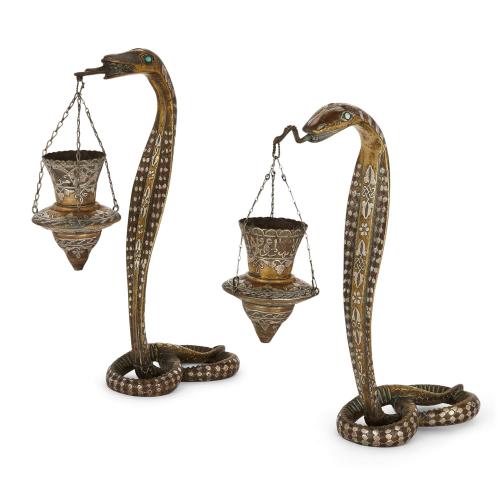 Pair of silver inlaid brass serpent candle holders