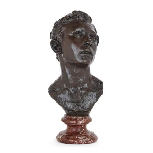 Patinated bronze antique bust of a young man by Dalou