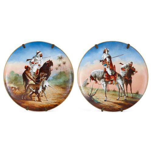 Pair of antique porcelain plates depicting Arab horsemen