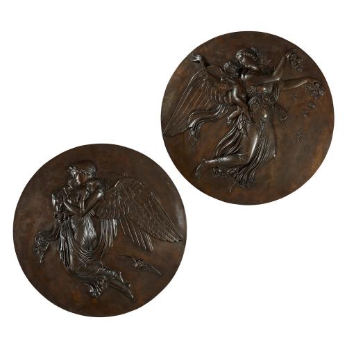 Pair of patinated bronze antique plaques of Night and Day
