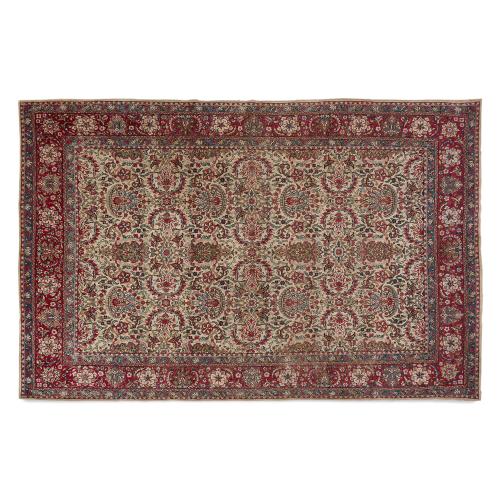 Antique Persian woven wool Kirman carpet