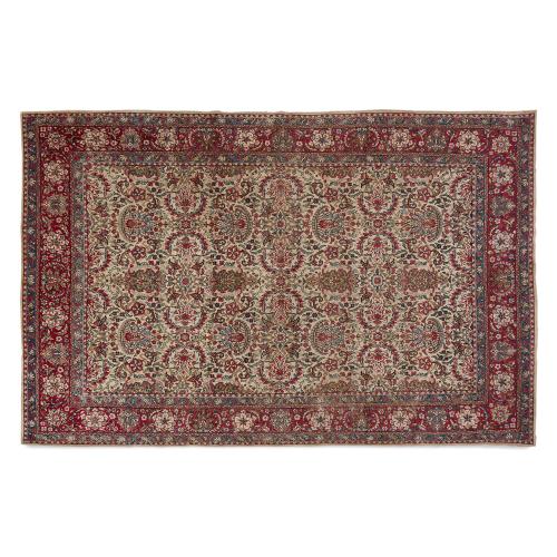 Antique Persian woven wool Kirman carpet