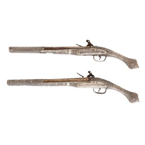 Pair of Balkan silver and gold-damascened flintlock pistols