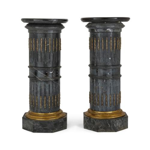Pair of ormolu mounted black marble antique pedestals