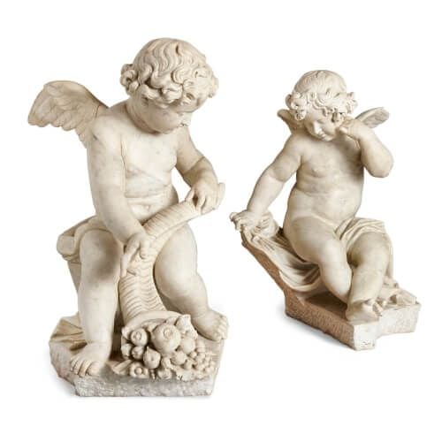 Pair of Louis XV period winged cherub marble sculptures