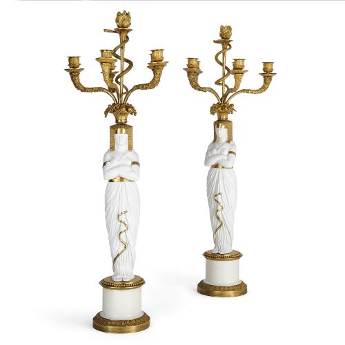 Pair of ormolu and bisque porcelain candelabra by Nast