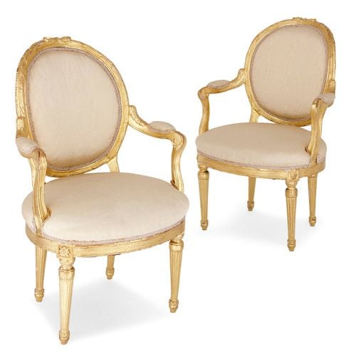 Pair of antique Louis XVI style giltwood armchairs 