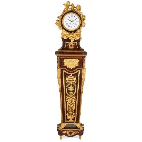 Rococo style ormolu mounted pedestal clock after Riesener