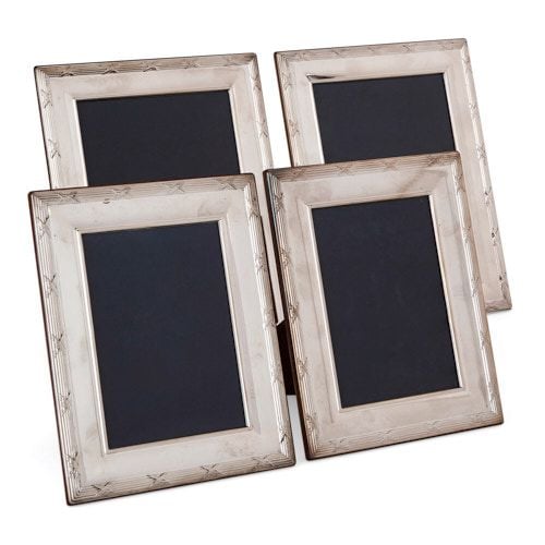Set of four English Carrs silver photo frames 