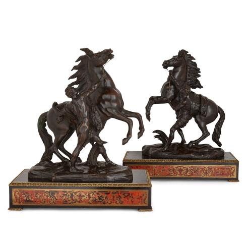 Pair of patinated bronze Marly horses on Boulle plinths