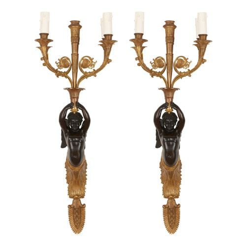 Pair of Empire style gilt and patinated bronze wall lights