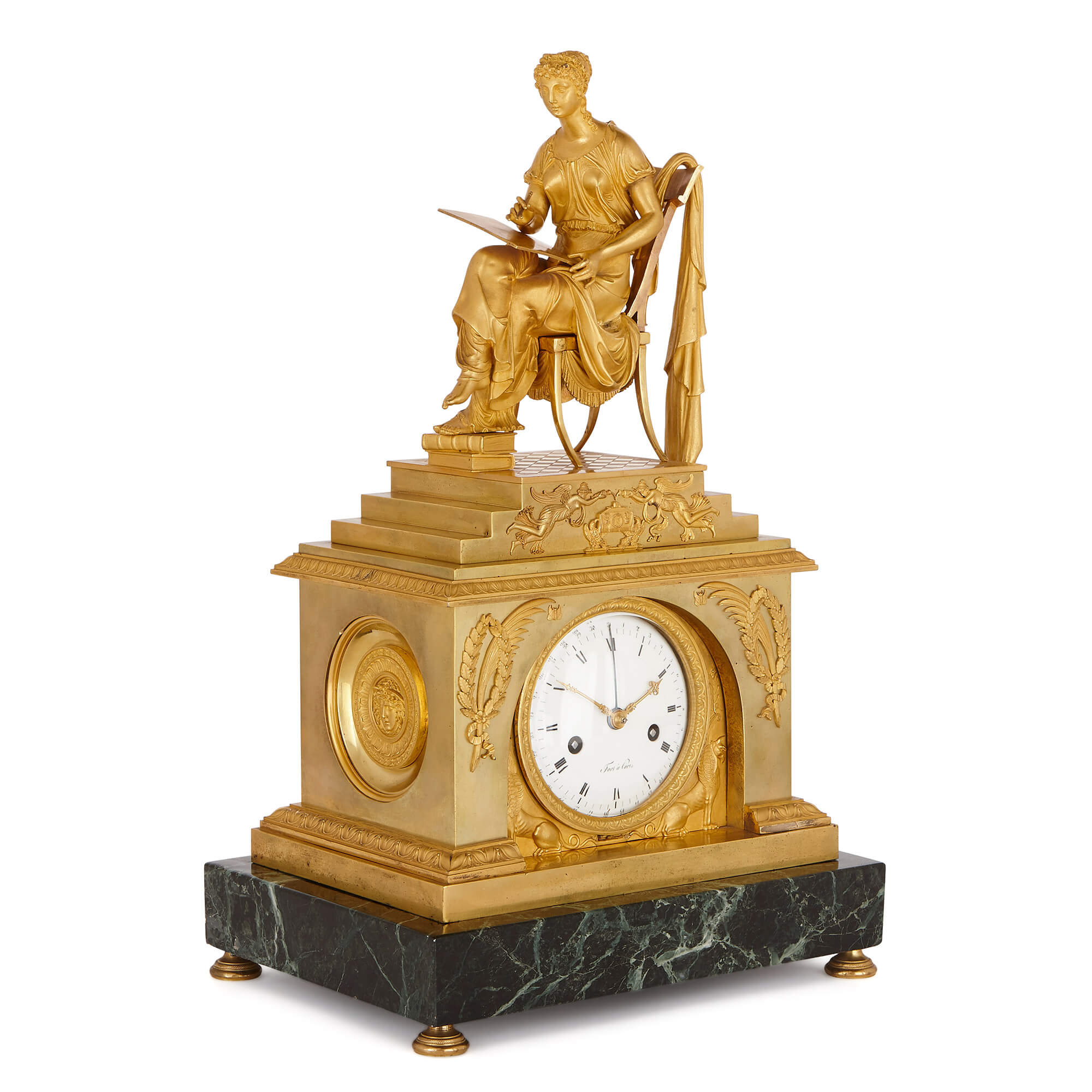 French Empire Period Ormolu And Marble Mantel Clock By Fort Mayfair Gallery The clock case is surmounted by the seated figure of an indian with a bow in one hand and a spear in the other, resting her feet on the head of an it has pierced gilt hands and a beaded ormolu border. french empire period ormolu and marble