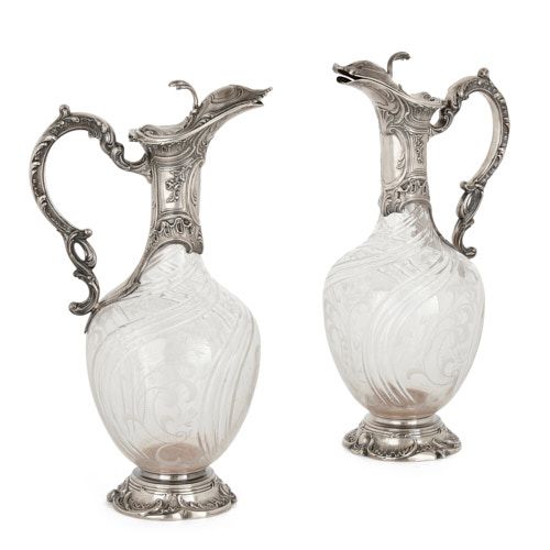 Pair of silver and crystal claret jugs by Charles Hack