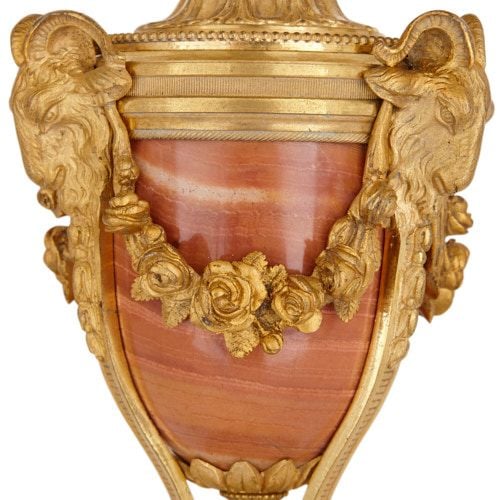 A Louis XVI style ormolu and marble three piece clock set