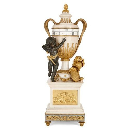 Louis XVI style ormolu and marble cercle tournant mantel clock