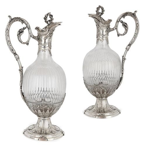 Pair of silver and crystal claret jugs by Victor Boivin