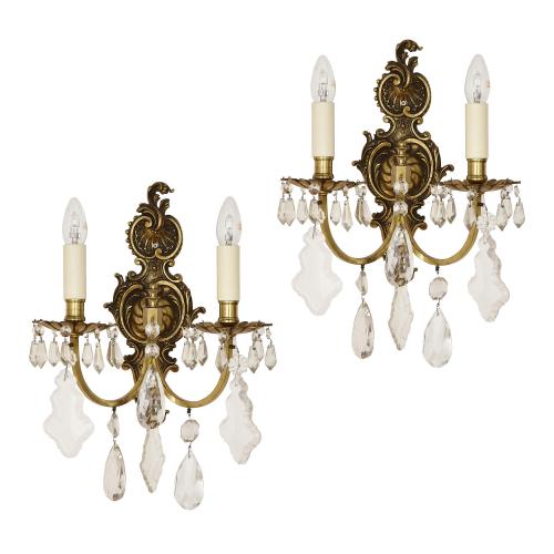 Pair of gilt metal and cut glass Rococo style wall lights