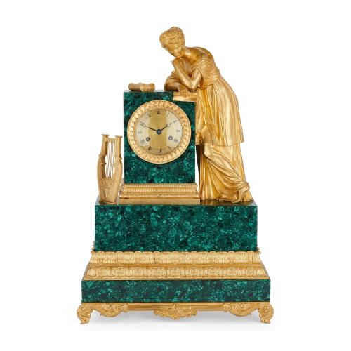 Empire style gilt bronze and malachite sculptural mantel clock