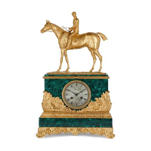 A Charles X style ormolu and malachite equestrian mantel clock