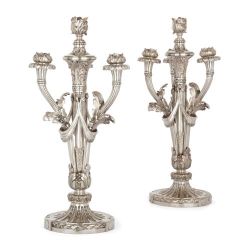 Pair of four-light silvered bronze candelabra by Christofle