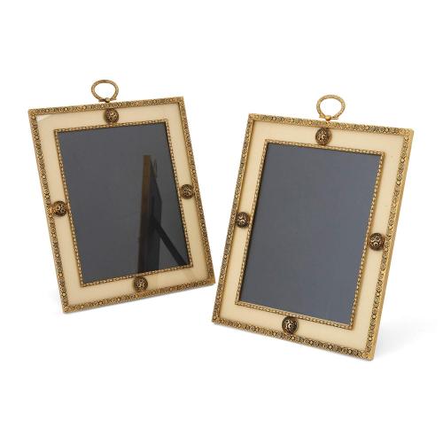 Pair of French silk and gilt metal photograph frames by Puiforcat