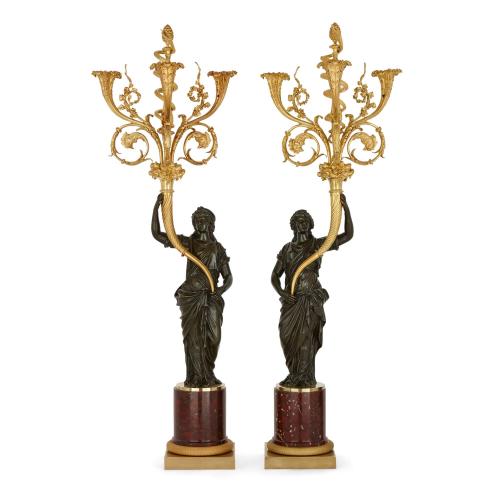 A pair of large French ormolu and patinated bronze candelabra