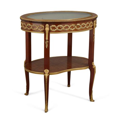 An ormolu mounted mahogany and bois satine vitrine table by Linke