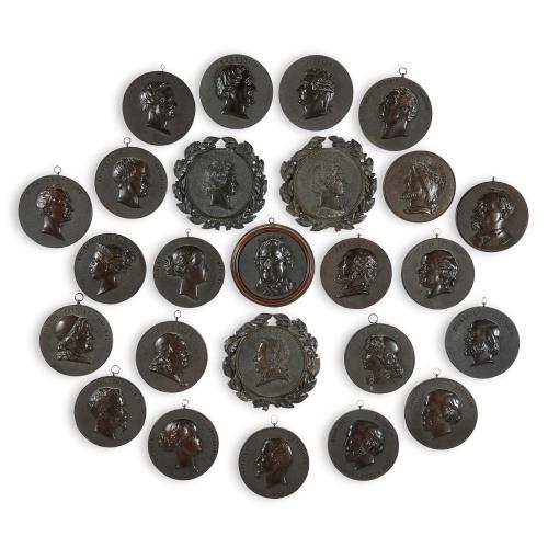  A group of nineteenth century Bois Durci roundels by F. Lepage