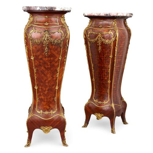 Pair of ormolu-mounted parquetry and marble pedestals by Hugnet