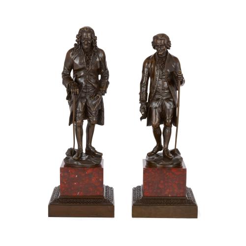 Pair French patinated bronze sculptures of Voltaire and Rousseau