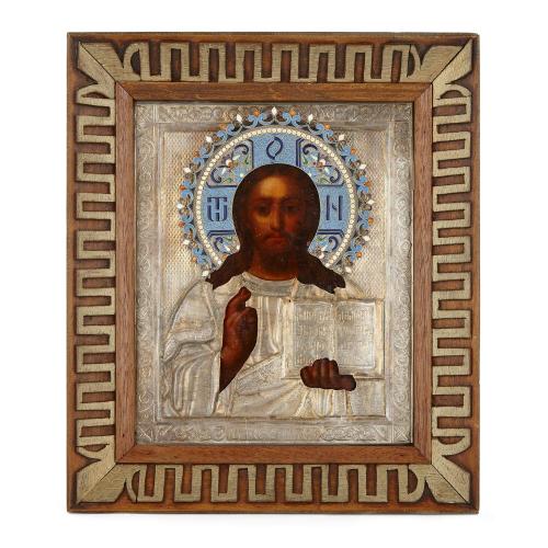 A silver gilt and cloisonné enamel Russian icon of Christ