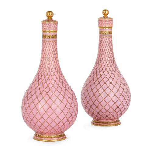 Pair of pink and gilt lattice Sèvres style porcelain bottle vases