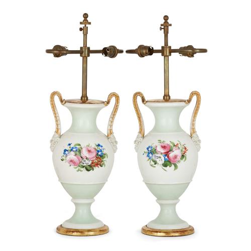 Pair of antique porcelain lamps with painted floral decoration