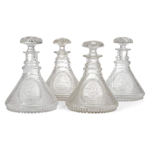 Set of four English engraved glass ship's decanters with stoppers
