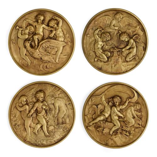 Set of four gilt bronze high-relief plaques by M. Moreau 