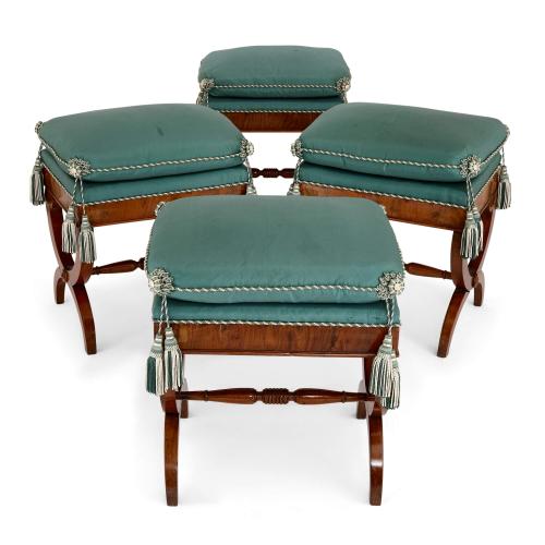 Set of four Italian upholstered walnut X-frame stools