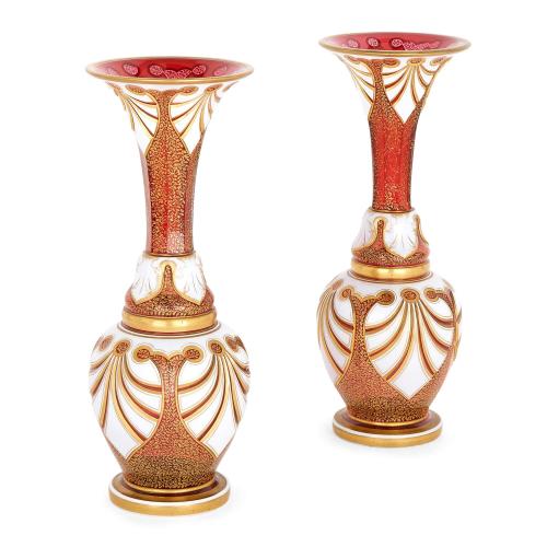 Pair of Bohemian overlay ruby glass and parcel gilt vases