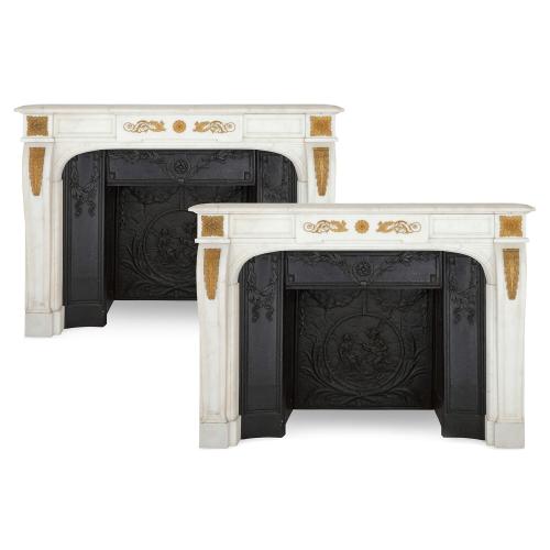 Pair of antique marble and ormolu fireplaces with cast iron insets
