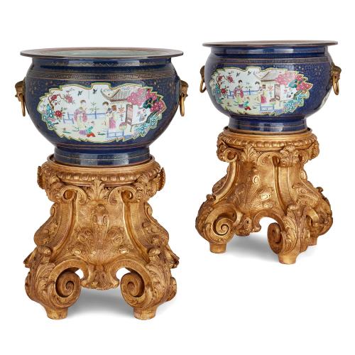 Pair of large Chinese porcelain fish bowls with giltwood stands