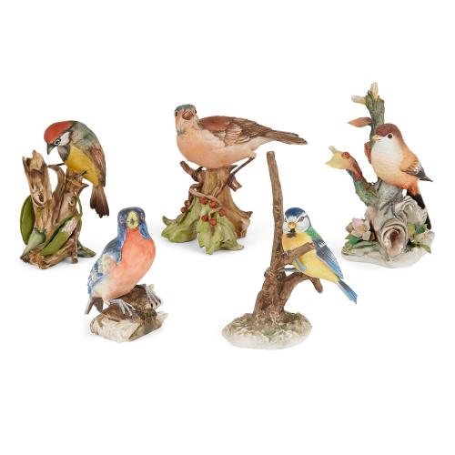 Collection of five Continental bisque porcelain bird models