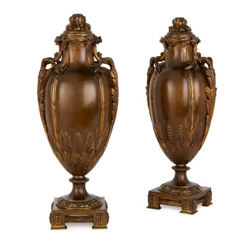 Pair of gilt and patinated bronze lidded antique vases