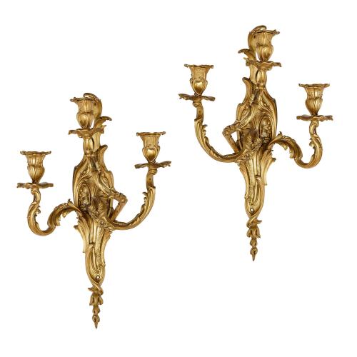 Pair of Louis XV style ormolu three-light wall lights