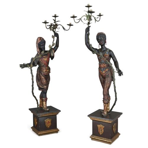 Pair of large Baroque style ebonised wood figural candelabra