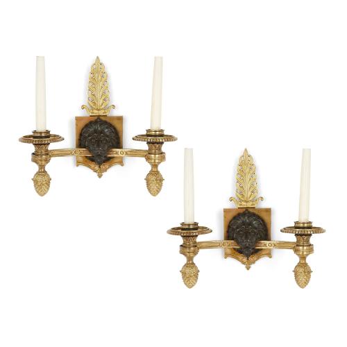 Pair of French Empire-style gilt and patinated bronze wall lights  