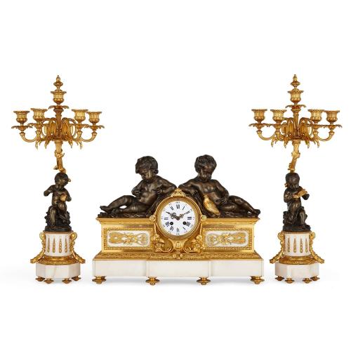 French patinated and gilt bronze mounted white marble clock set