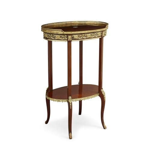 Ormolu mounted mahogany antique oval shaped two tiered table