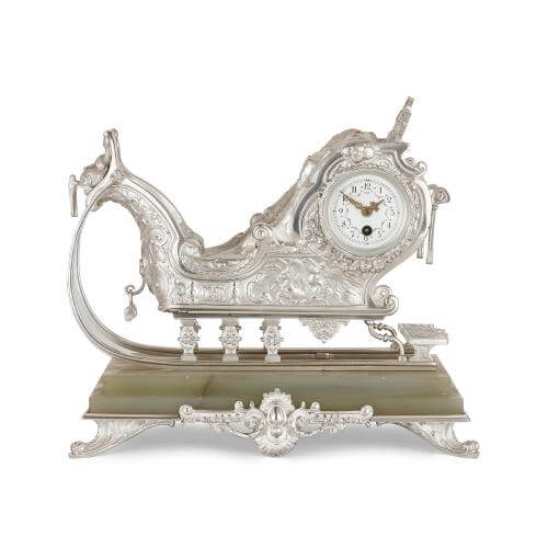 Silvered bronze and onyx mantel clock in the form of a sleigh