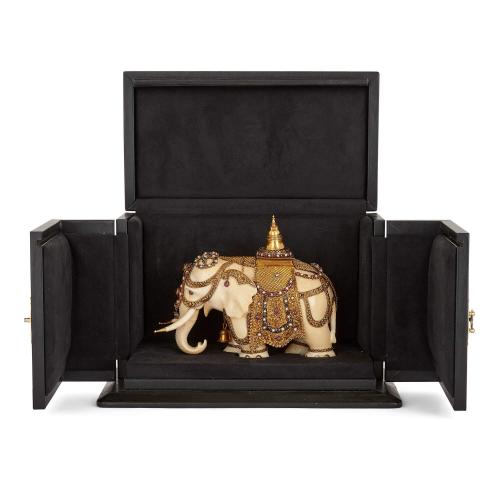 Antique Indian gold mounted ivory model of an elephant